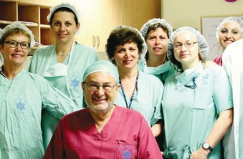 DR. ADRIAN ELLENBOGEN with hospital staff 370 (photo credit: Courtesy Hillel Yaffe Medical Center)
