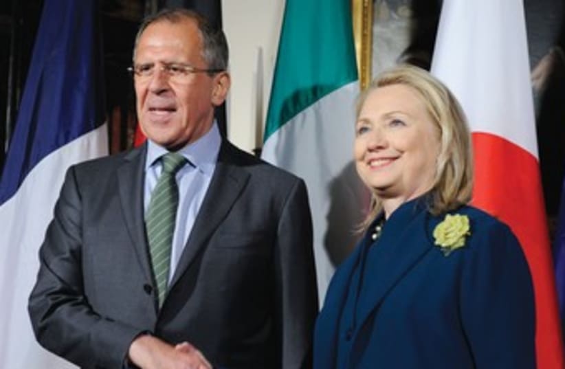 Hillary Clinton with Russian FM Sergei Lavrov 370 (R) (photo credit: Mike Theiler/Reuters)
