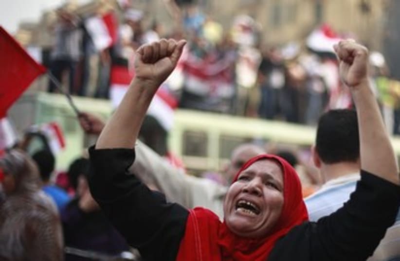 Supporters of Morsy celebrate self-declared vote win 37 (photo credit: REUTERS/Suhaib Salem)
