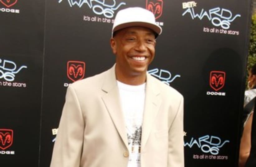 Russell Simmons 370 (R) (photo credit: Fred Prouser / Reuters)