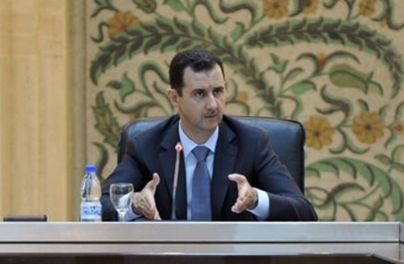 Syrian President Bashar Assad 370 (R) (photo credit: Sana / Reuters)