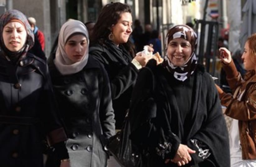 Palestinian women walking in J'lems Old City 370 (photo credit: HAMZE AWAWDE)