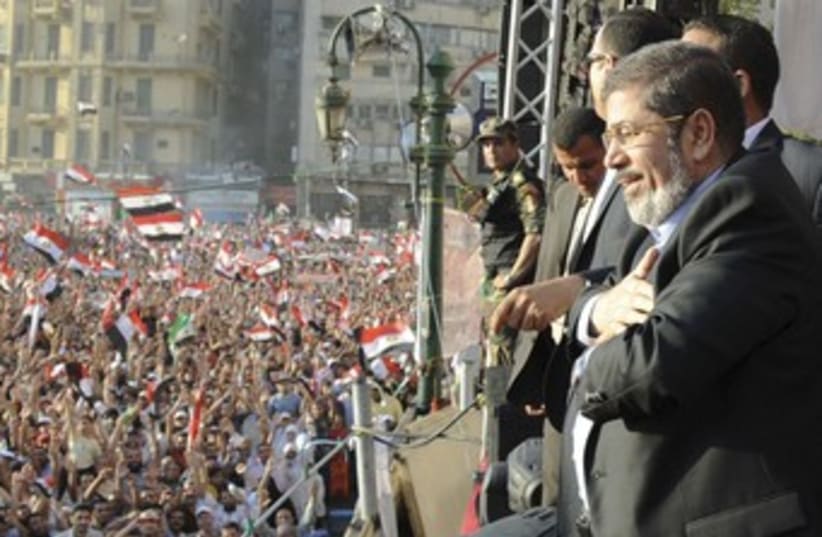 Egypt's Mohamed Mursi at Tahrir Square rally 370 (R) (photo credit: REUTERS / Handout)