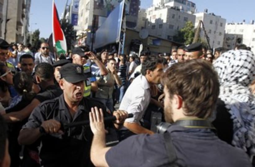 PA security forces scuffle with protesters in Ramallah 370 (photo credit: REUTERS)