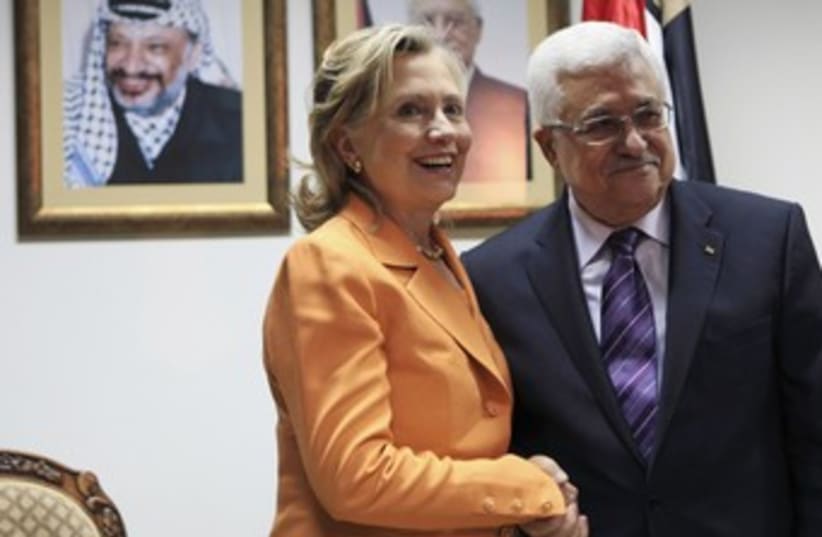 Clinton with Abbas during 2010 Ramallah visit 370 (R) (photo credit: Fadi Arouri / Reuters)