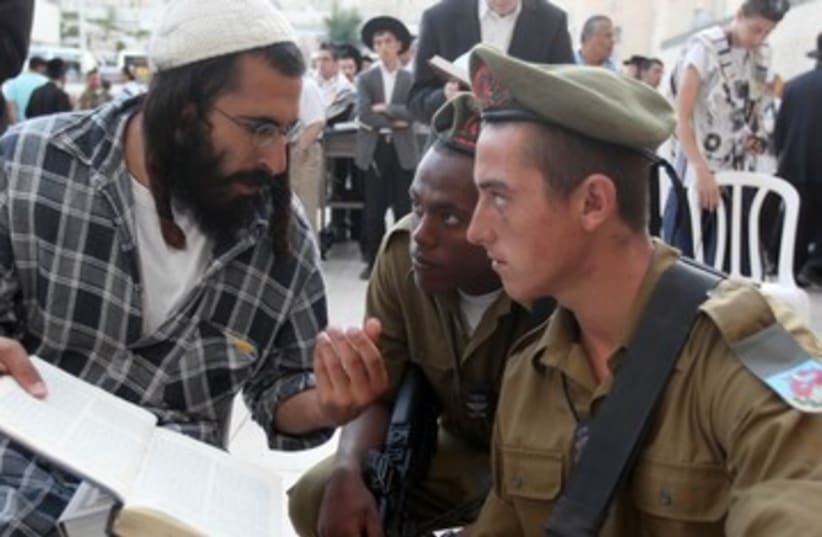 Orthodox man talks with soldiers (photo credit: Marc Israel Sellem)