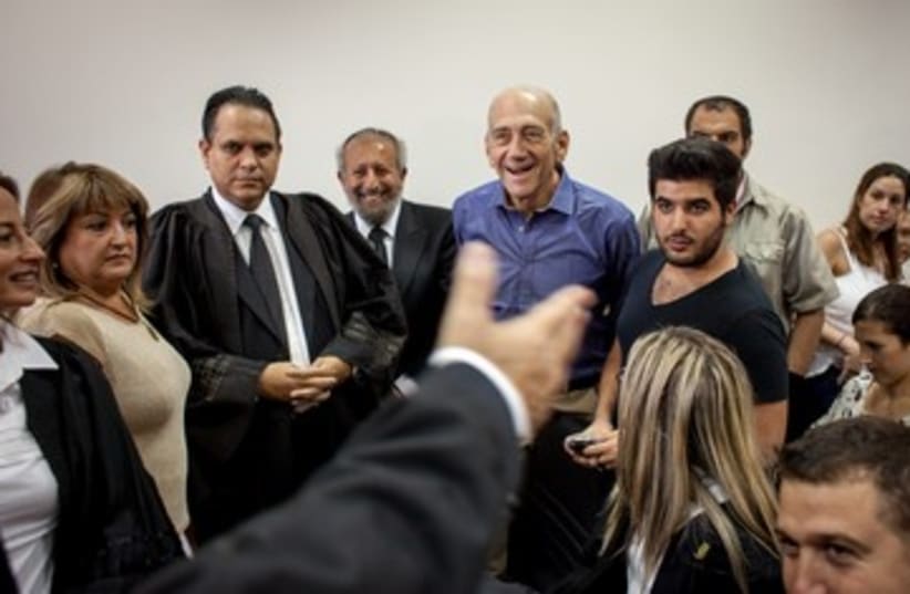 Ehud Olmert rejoices following court verdict 370 (photo credit: Emile Solomon/ Haaretz)
