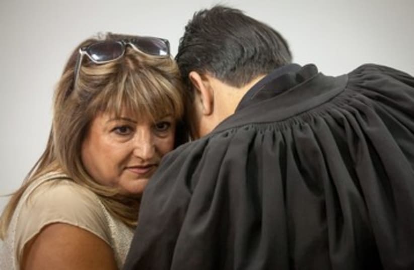 Shaula Zaken embraces lawyer 370 (photo credit: Emile Solomon/ Haaretz)