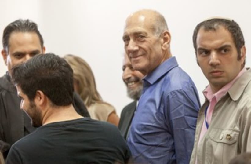Former PM Ehud Olmert after verdict 370 (photo credit: Emil Salman/ Pool)