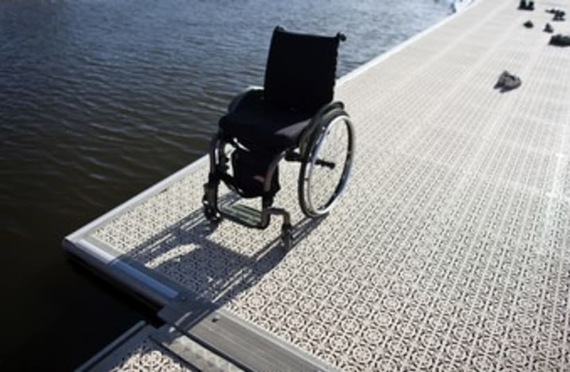 A wheelchair at Tel Aviv's Yarkon River 370 (photo credit: NIR ELIAS / Reuters)
