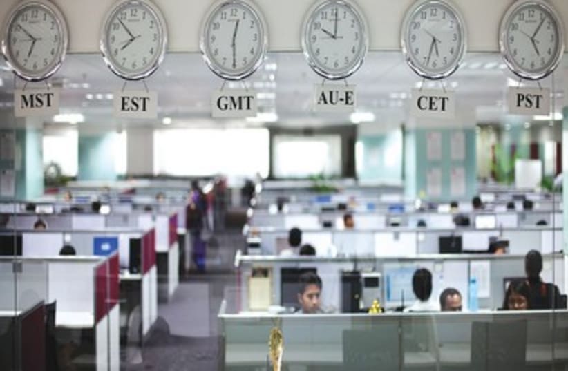 Office with clocks (R390) (photo credit: REUTERS)
