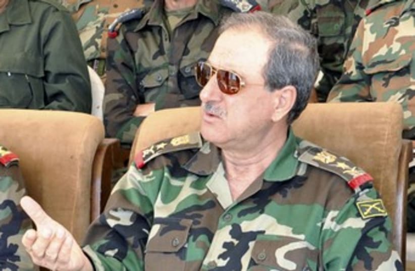 Syrian Defense Minister Daoud Rajha (R) 370 (photo credit: Sana / Reuters)