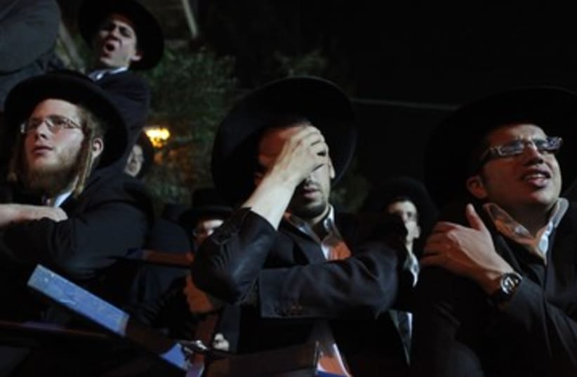 A haredi man overcome with grief (photo credit: Marc Israel Sellem/The Jerusalem Post)