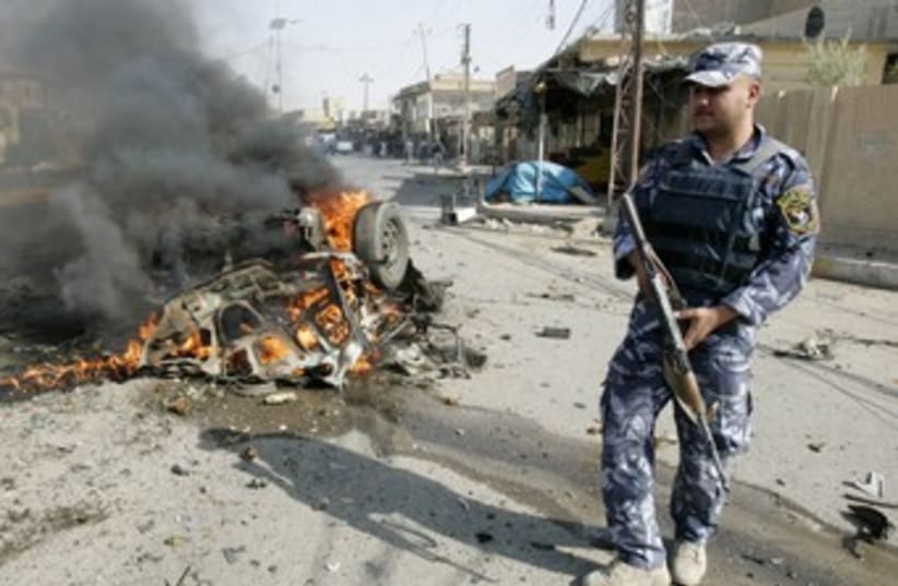 Iraqi police at site of Kirku bomb attack 370 (photo credit: REUTERS)