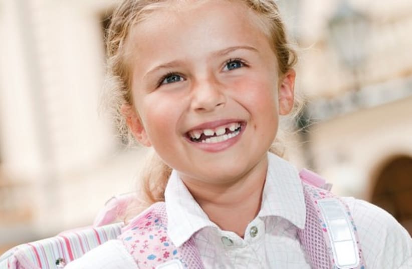 Girl with schoolbag (photo credit: Thinkstock)