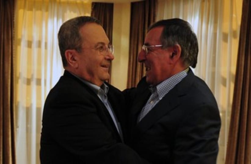 Ehud Barak Leon Panetta hug 390 (photo credit: Ariel Harmoni / GPO)