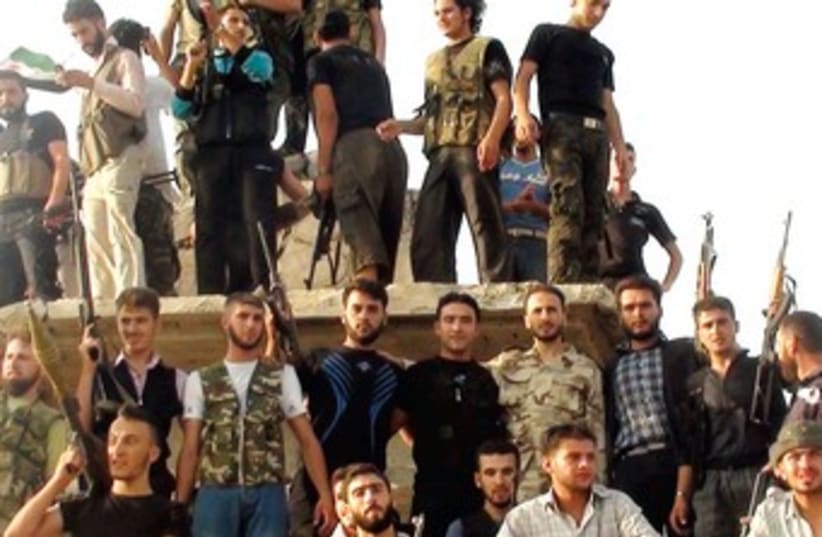 Free Syrian Army members in al-Rasten, near Homs 370 (photo credit: REUTERS)