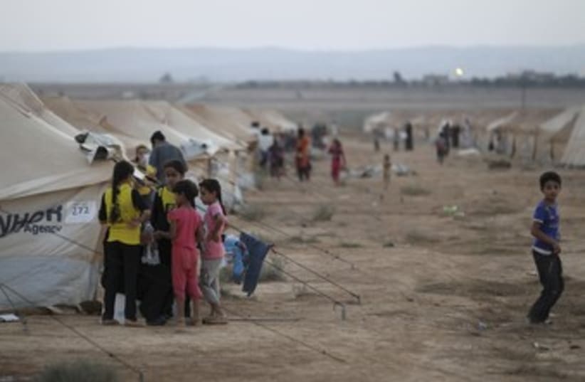 Syrian refugees at Zaatari camp in Jordan 370 (R) (photo credit: Muhammad Hamed / Reuters)