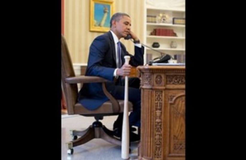 Obama holds baseball bat 370 (photo credit: White House)