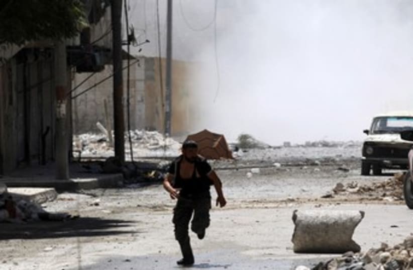 Syria fighting 370 (photo credit: Goran Tomasevic / Reuters)