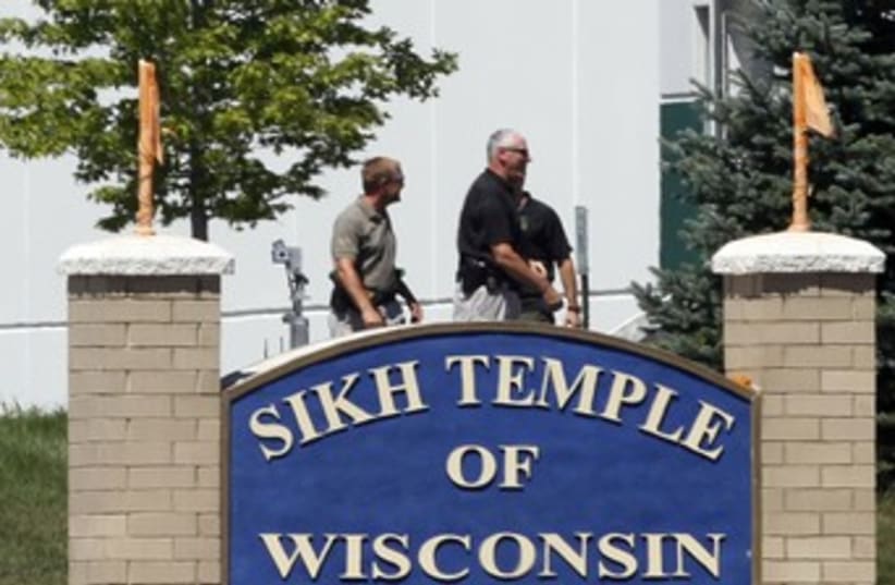 Officials gather near Wisconsin Sikh Temple 370 (photo credit: REUTERS/Allen Fredrickson)