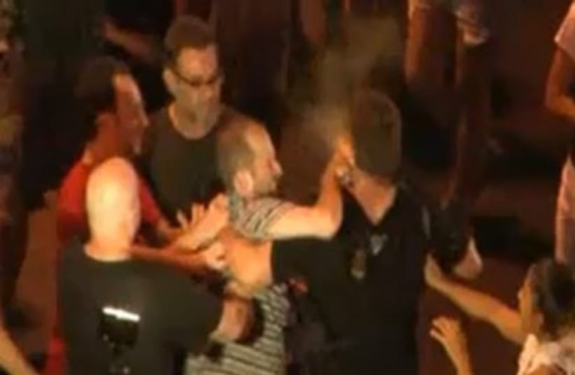 Man pepper-sprays cop at social justice rally 370 (photo credit: YouTube Screenshot)
