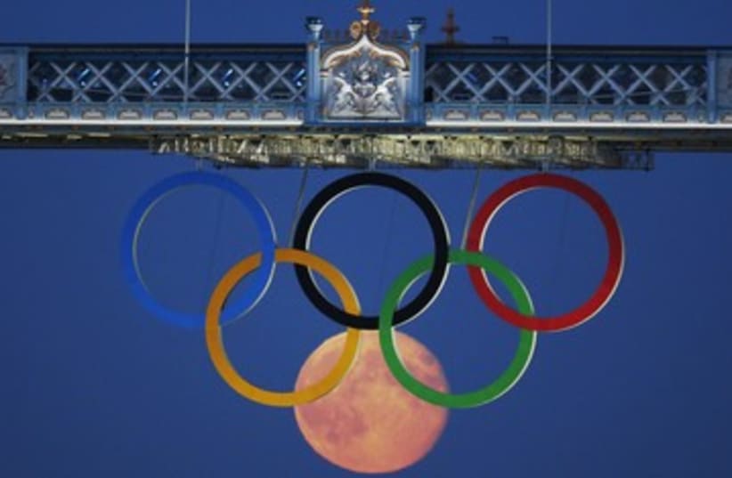 Olympic Rings with moon London 2012 390 (photo credit: Luke MacGregor / Reuters)