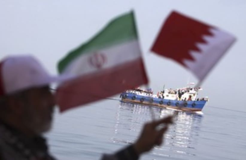 Iranian waves Iran and Bahrain flags 370 (photo credit: REUTERS/Handout .)