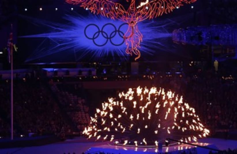 Olympic flame during the closing ceremony 370 (photo credit: Luke MacGregor / Reuters)