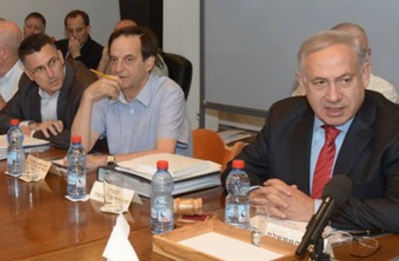 PM Netanyahu at defense budget cabinet meeting 370 (photo credit: GPO / Amos Ben-Gershom)