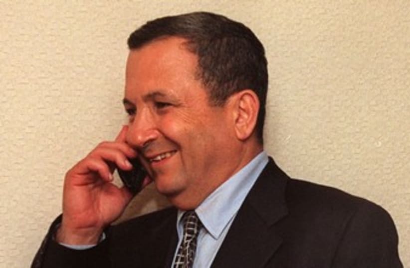 Ehud Barak talks on the phone 370 (photo credit: REUTERS/POOL Old)