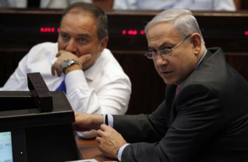 PM Binyamin Netanyahu and FM Avigdor Lieberman 370 (R) (photo credit: Baz Ratner / Reuters)