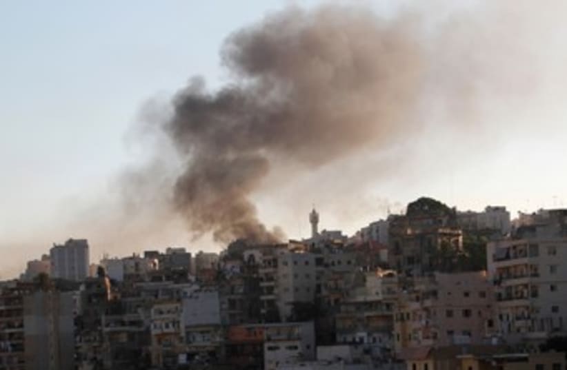 Smoke rises in Lebanon's Tripoli 370 (photo credit: REUTERS/Stringer)
