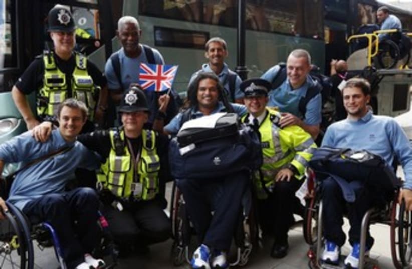 British policemen with French Paralympics team 370 (photo credit: REUTERS)