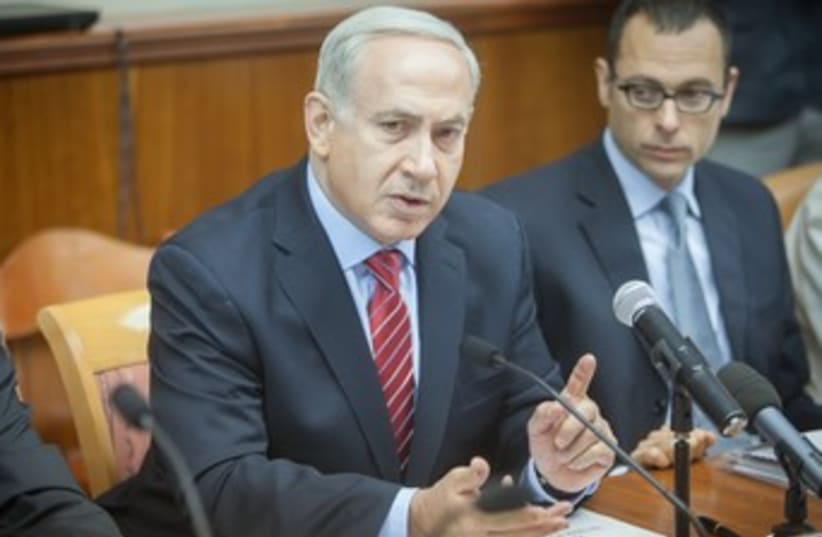 Netanyahu at cabinet meeting 370 (photo credit: Pool/Eli Selman)