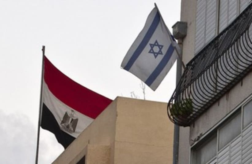 Egyptian flag hangs at embassy in Tel Aviv 370 (photo credit: REUTERS/NIR ELIAS)