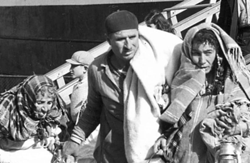 Jewish refugees from Triploi arrive in Haifa 521 (photo credit: Arnold Behr/Jerusalem Post Archives)