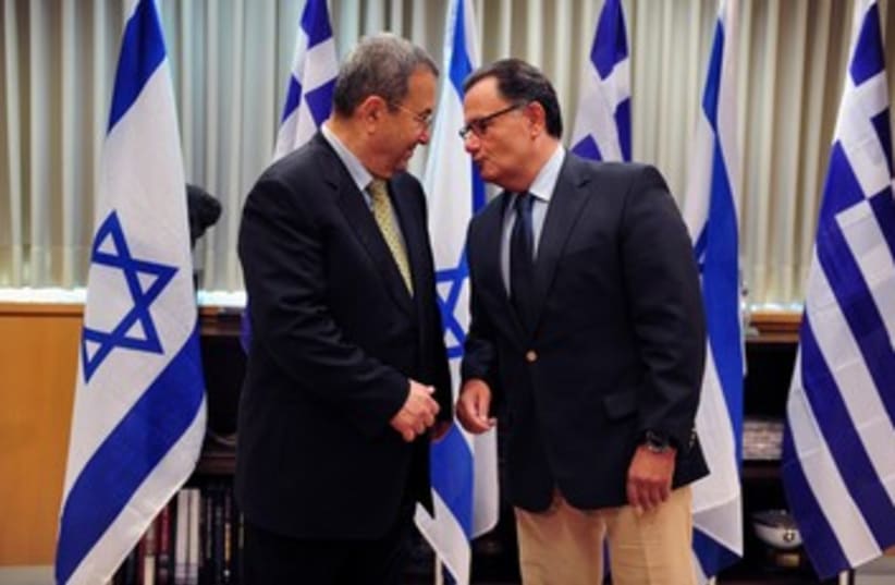 Greek DM Panos Panagiotopoulos with Barak 370 (photo credit: Ariel Harmoni / Defense Ministry)