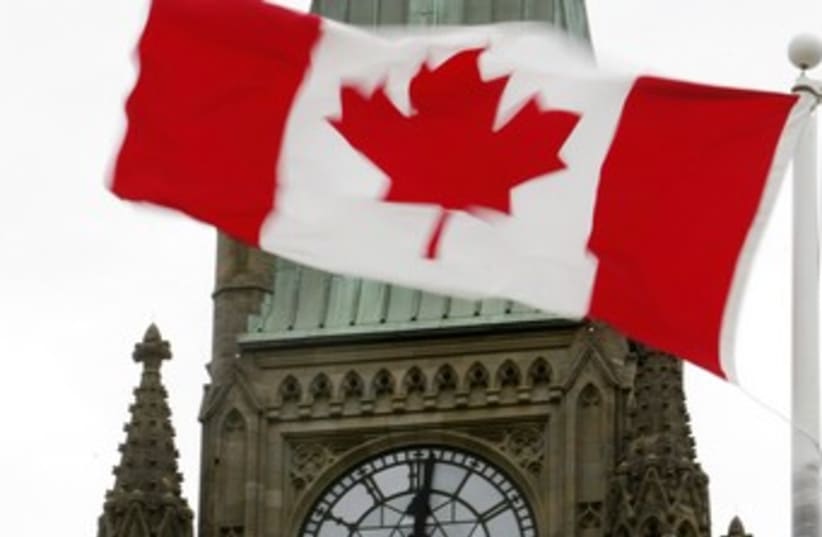 Canadian flag at Parliament in Ottawa 370 (photo credit: REUTERS)
