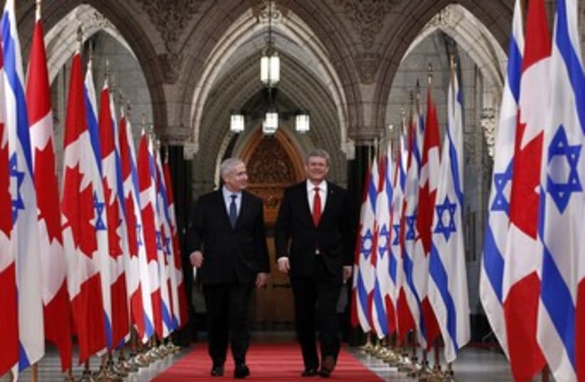 Netanyahu walks with Harper 370 (photo credit: REUTERS/Chris Wattie)