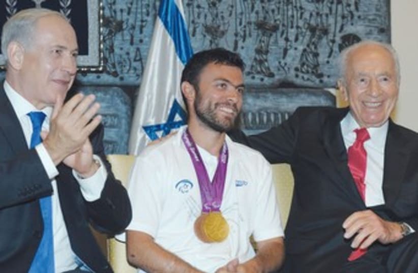 Paralympic tennis player Noam Gershony with Peres, PM 370 (photo credit: GPO)