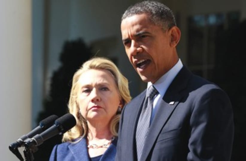 Hillary Clinton and Barack Obama tough 390 (photo credit: Jason Reed/Reuters)