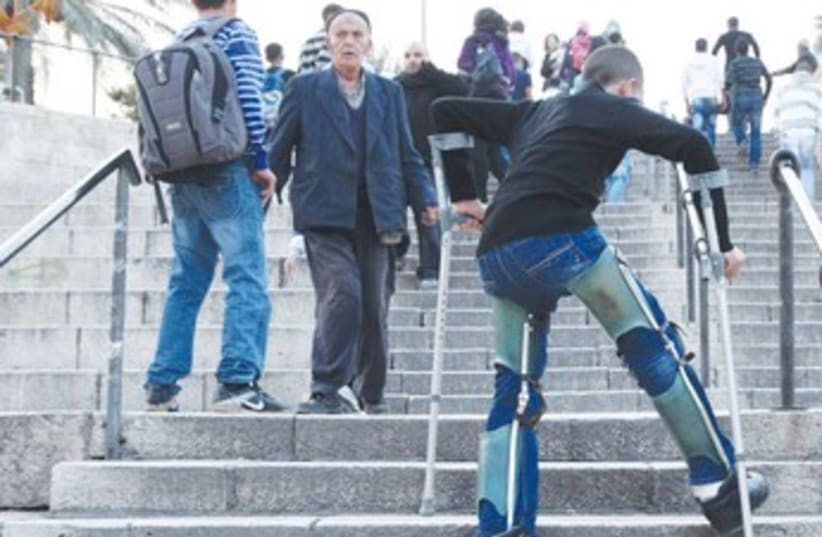 Disabled bot climbs stairs 370 (photo credit: Marc Israel Sellem/The Jerusalem Post)