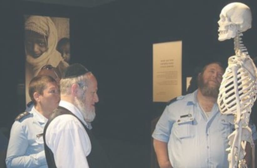 Religious Jews observe Bodies exhibit 370 (photo credit: Courtesy ZAKA)