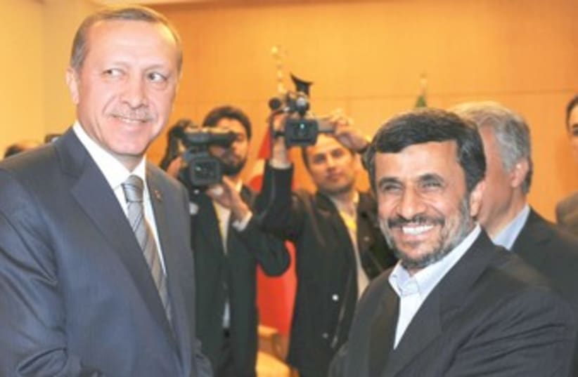 Erdogan with Ahmadinejad 370 (photo credit: Bulent Kilic/Reuters)