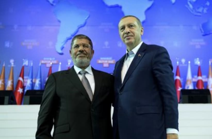 Morsy and Erdogan (photo credit: REUTERS)