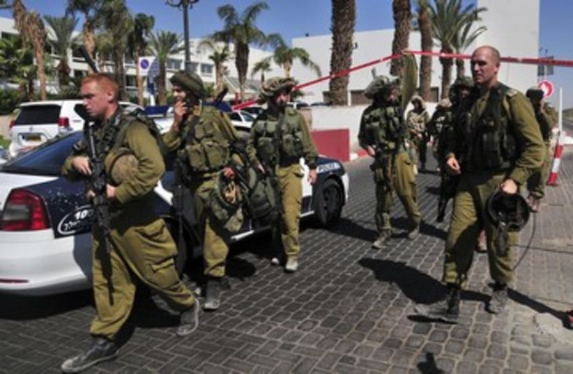 IDF soldiers guard the area near Eilat hotel 390 (photo credit: REUTERS)