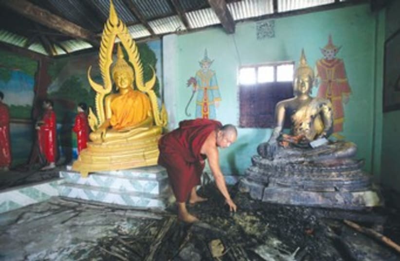 Burnt Buddhist temple 370 (photo credit: REUTERS)