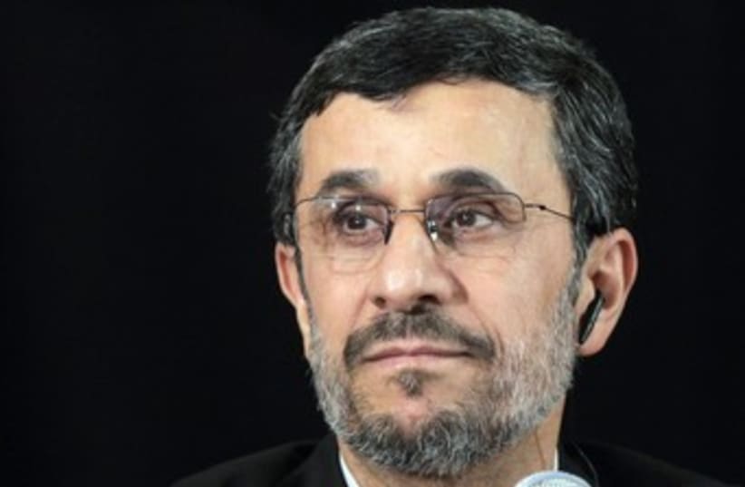 Iranian President Mahmoud Ahmadinejad (black background) 370 (photo credit: REUTERS/Brendan McDermid)