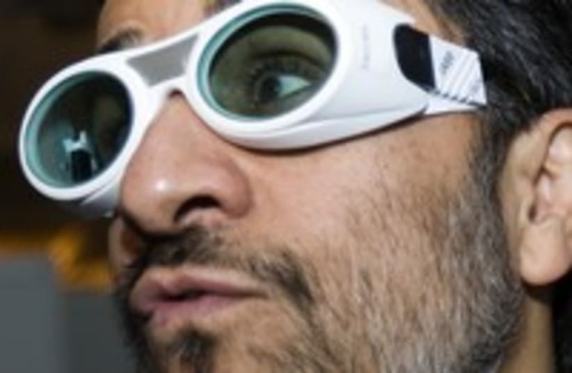 Iran Mahmoud Ahmadinejad laser conference goofy glasses 300 (photo credit: REUTERS/Raheb Homavandi)